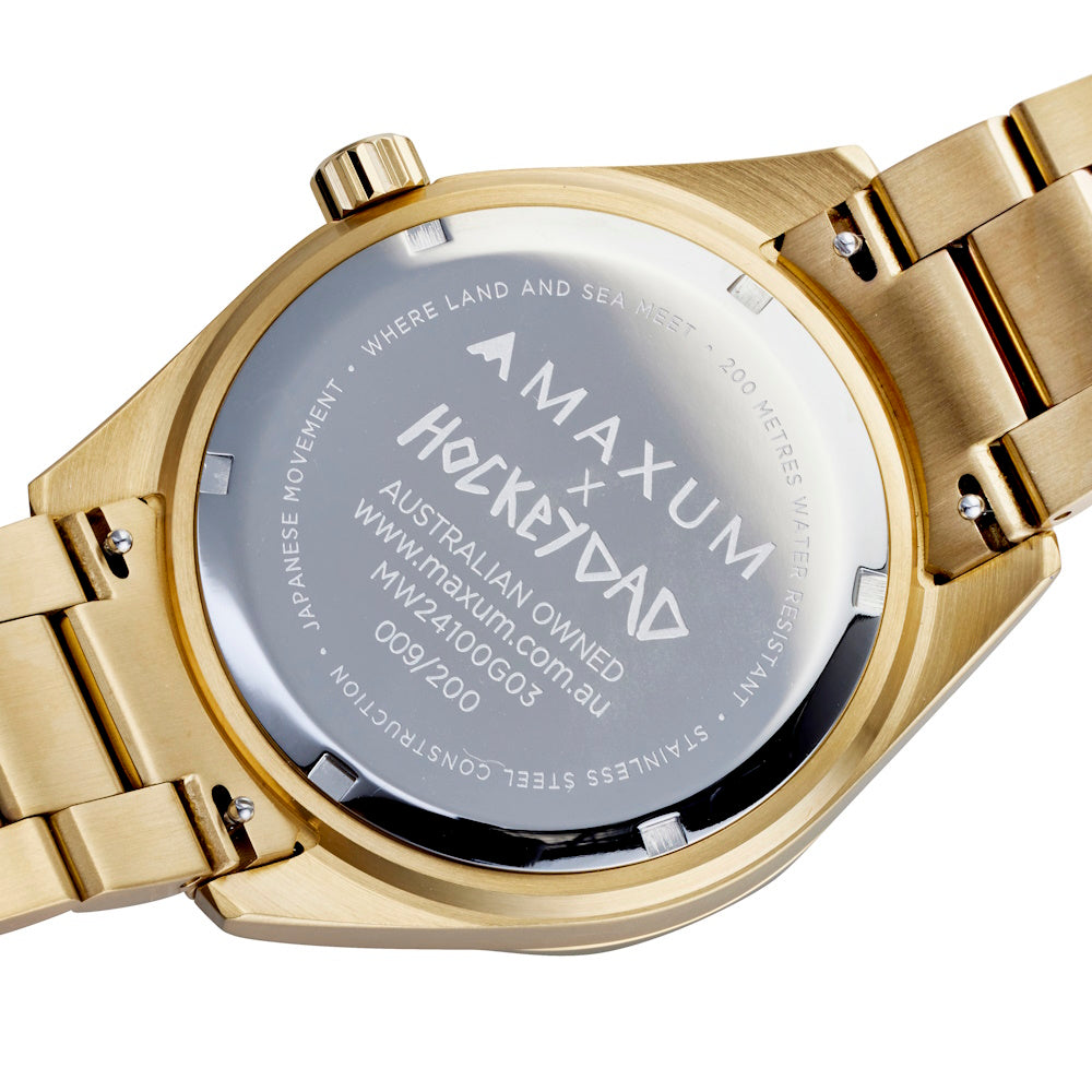 Maxum Hockey Dad Limited Edition Blue Watch. A gold stainless steel bracelet watch with a blue dial and gold casing, branded with 'HOCKEY DAD' and 'MAXUM'. Back engraving detail