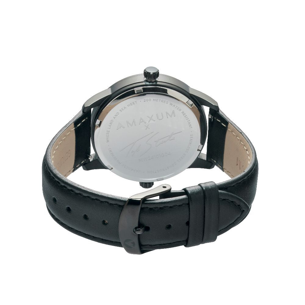 Maxum x Taylor Steele collab- black analog watch with a black dial, black case, and black leather band, branded with 'MAXUM' on the top and indicating '200M' water resistance. Back view
