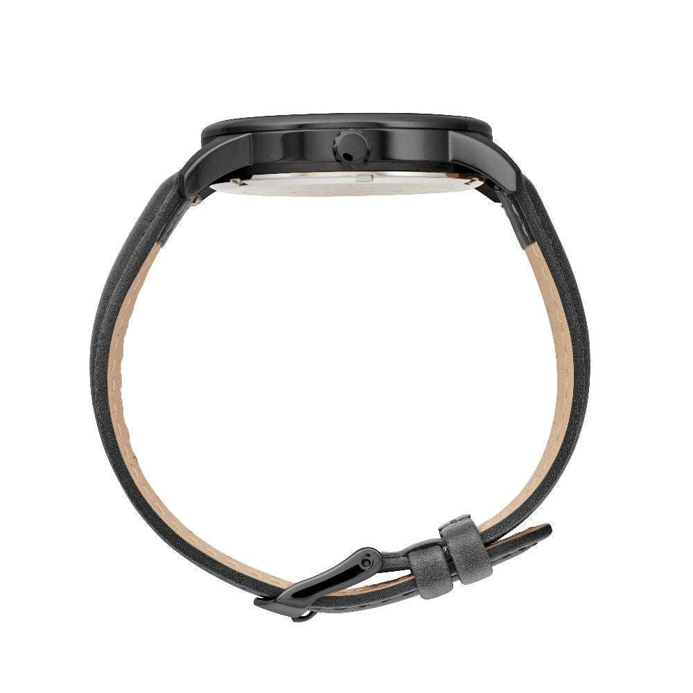 Maxum x Taylor Steele collab- black analog watch with a black dial, black case, and black leather band, branded with 'MAXUM' on the top and indicating '200M' water resistance. Side view