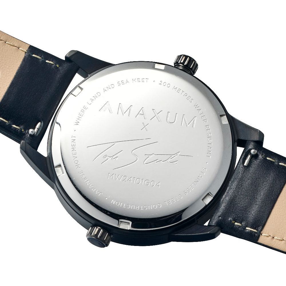 Maxum x Taylor Steele collab- black analog watch with a black dial, black case, and black leather band, back case engraving close up