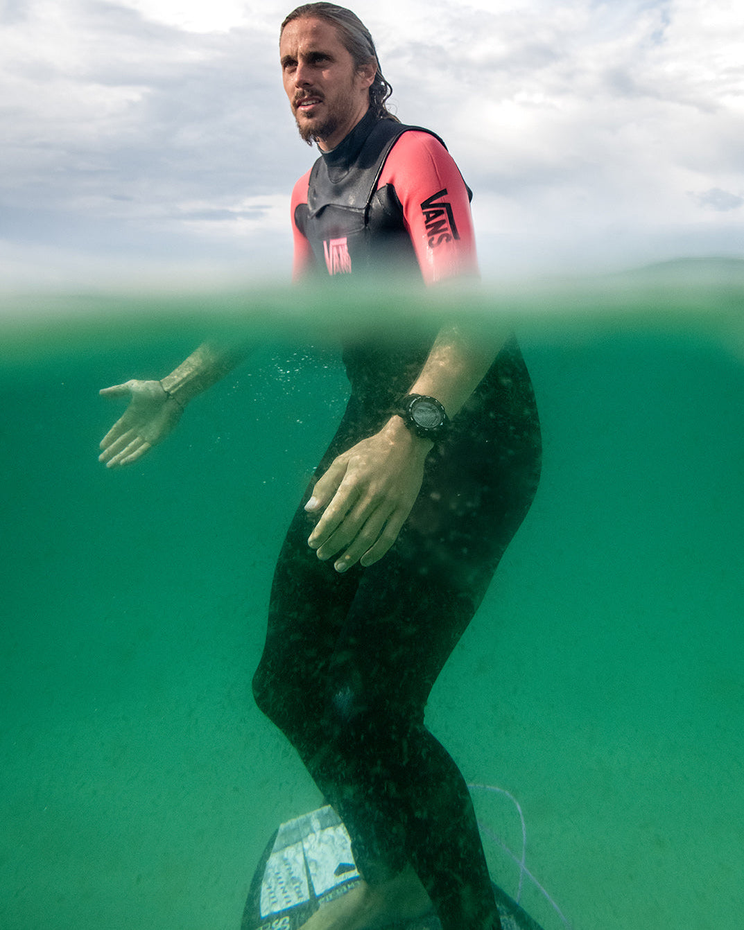 Maxum Basalt Black Digital Watch worn by surfer Kyuss King in the ocean,