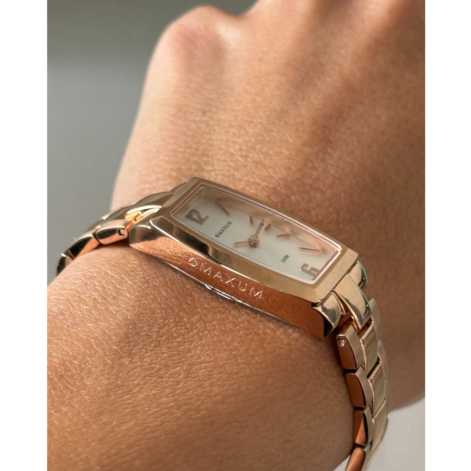 Maxum Fanta Reissue Rectangular rose gold-tone rectangular analogue watch with a white dial and a stainless steel bracelet.