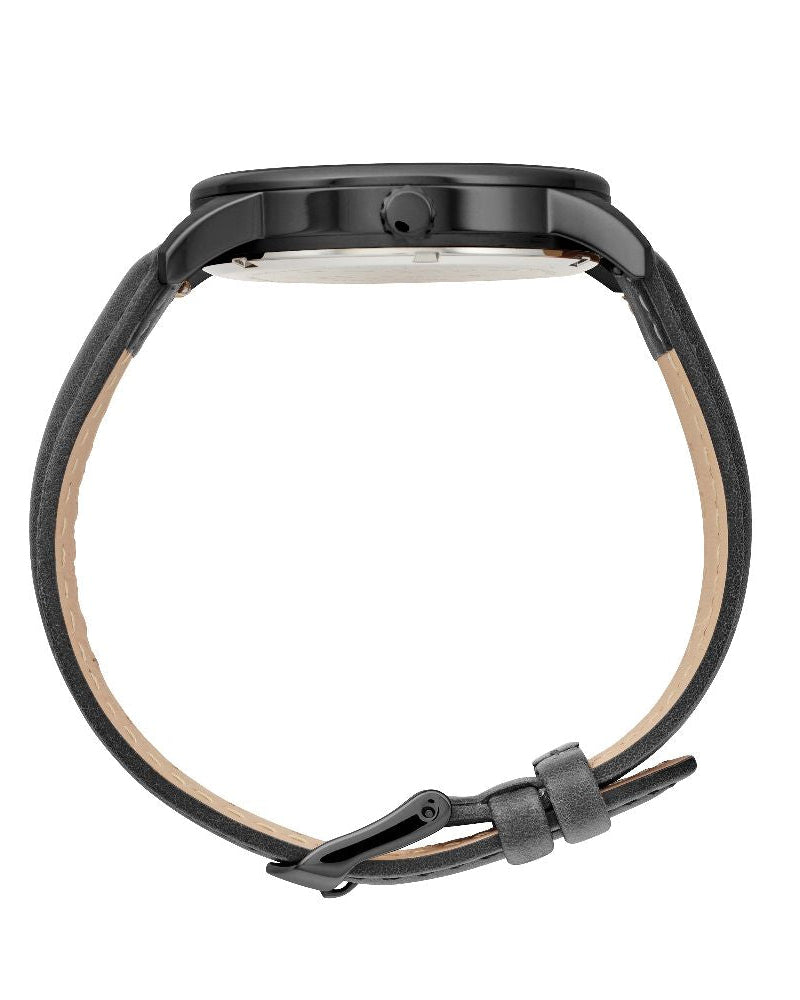 Maxum x Taylor Steele collab- black analog watch with a black dial, black case, and black leather band, branded with 'MAXUM' on the top and indicating '200M' water resistance. Side view